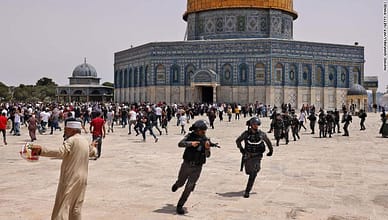 Israeli security forces and Palestinian worshipers clash in the Al Aqsa mosque compound in Jerusalem on Friday.