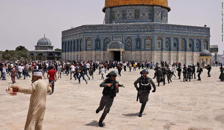 Israeli security forces and Palestinian worshipers clash in the Al Aqsa mosque compound in Jerusalem on Friday.